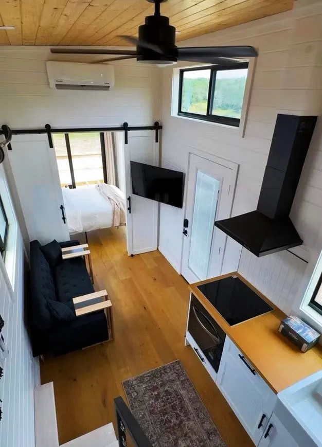 the getaway tiny home is a modern mini escape with downstairs bedroom and cozy loft 9